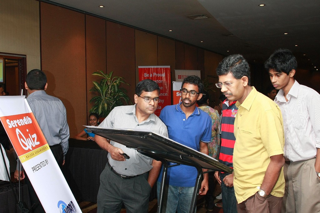 A team puzzling over questions at the inaugural Serendib Quiz held in Colombo, Sri Lanka. Credit: Nalaka Gunawardene