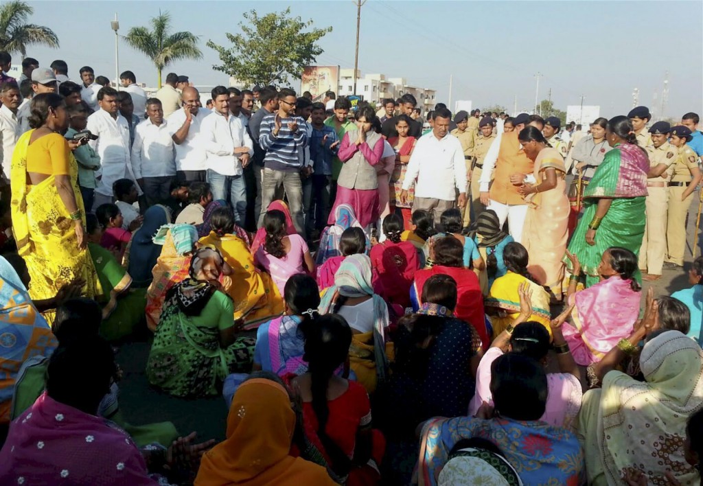 A group of women devotees, led by Trupti Desai (in pink), who headed the protest by women activists for entry to the Shani Shignapur temple complex, participate in a dharna at the temple in Ahmadnagar district on Tuesday. Credit: PTI