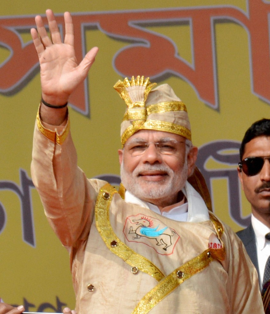 Prime Minister Narendra Modi waves at the crowd at a public rally at Moran in Dibrugarh district of Assam on Friday. Credit: PTI