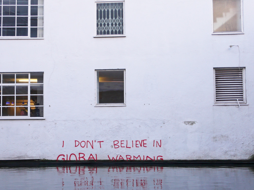 “I don't believe in global warming” by Banksy. Credit: dullhunk/Flickr, CC BY 2.0