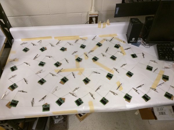 A batch of KickSat Sprites lying on a table. Credit: @zacinaction on Twitter