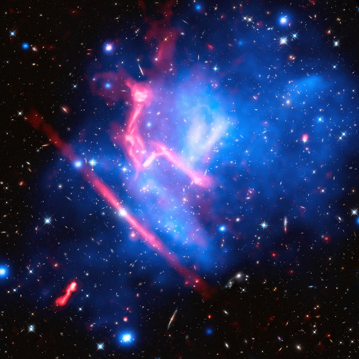 A 13-million lightyear long train of gases, galaxies and dark matter collided with a large volume of matter 5.4 billion lightyears away to give rise to MACS J0717. This image, a composite of those shot by Hubble, Chandra and the Jansky Very Large Array, New Mexico, shows the clash of four galaxies. Credit: NASA, ESA, CXC, NRAO/AUI/NSF, STScI, and R. van Weeren (Harvard-Smithsonian Center for Astrophysics)