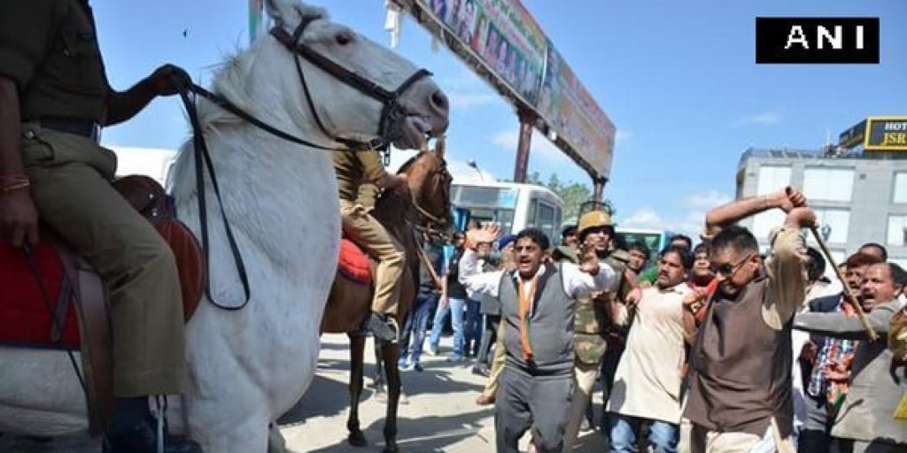 ANI photograph of the BJP MLA threatening the horse