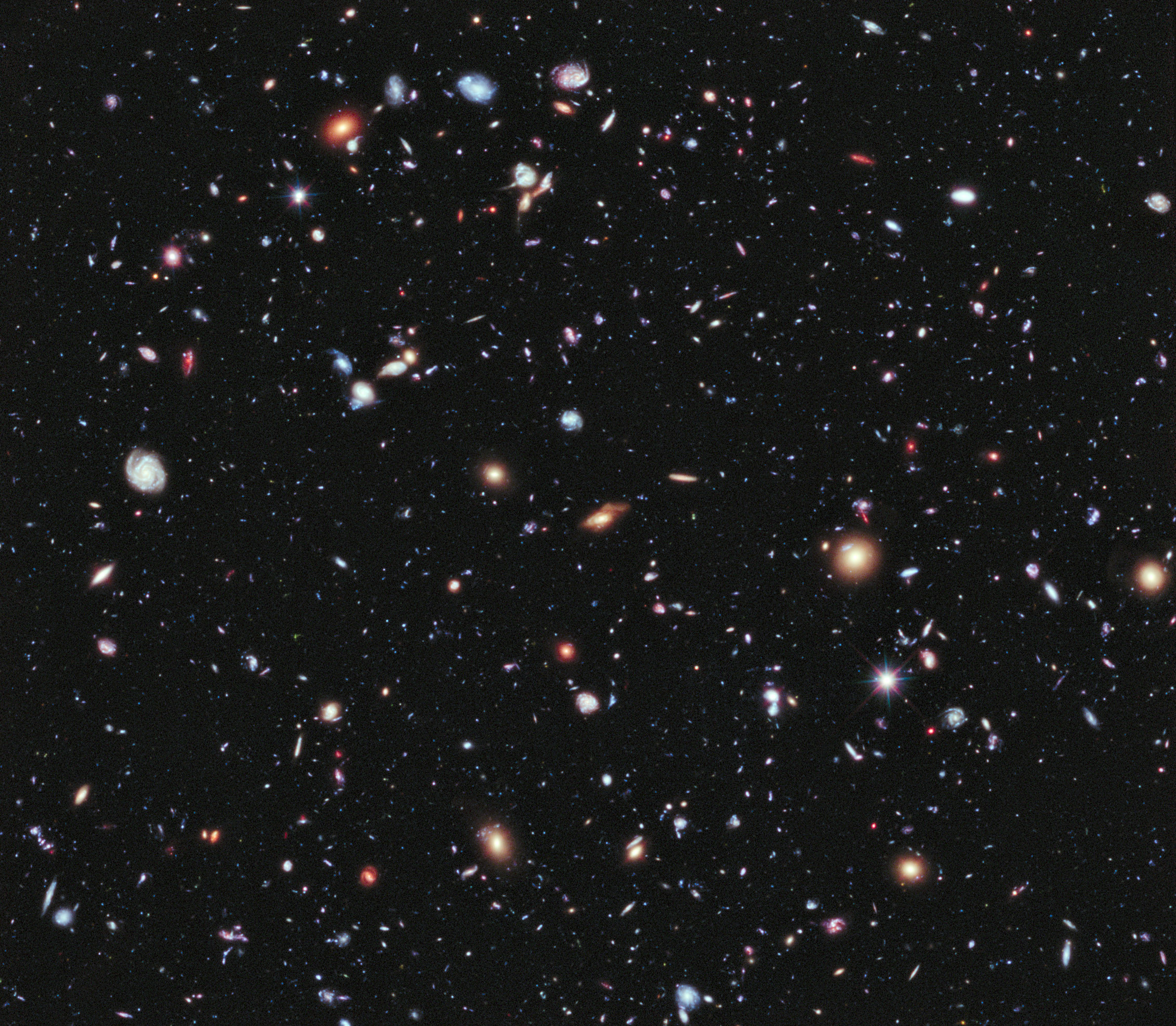 The Hubble Ultra Deep Field is an image of a small area of space in the constellation Fornax, created using Hubble Space Telescope data from 2003 and 2004. By collecting faint light over many hours of observation, it revealed thousands of galaxies, both nearby and very distant, making it the deepest image of the universe ever taken at that time. The new full-color XDF image is even more sensitive, and contains about 5,500 galaxies even within its smaller field of view. The faintest galaxies are one ten-billionth the brightness of what the human eye can see. Caption and credit: Credit: NASA; ESA; G. Illingworth, D. Magee, and P. Oesch, University of California, Santa Cruz; R. Bouwens, Leiden University; and the HUDF09 Team