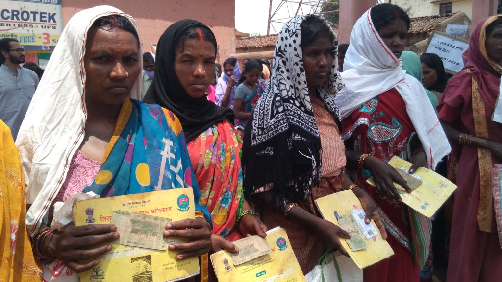 Workers holding up the five rupees and letters they will send. Photo courtesy Jean Dreze