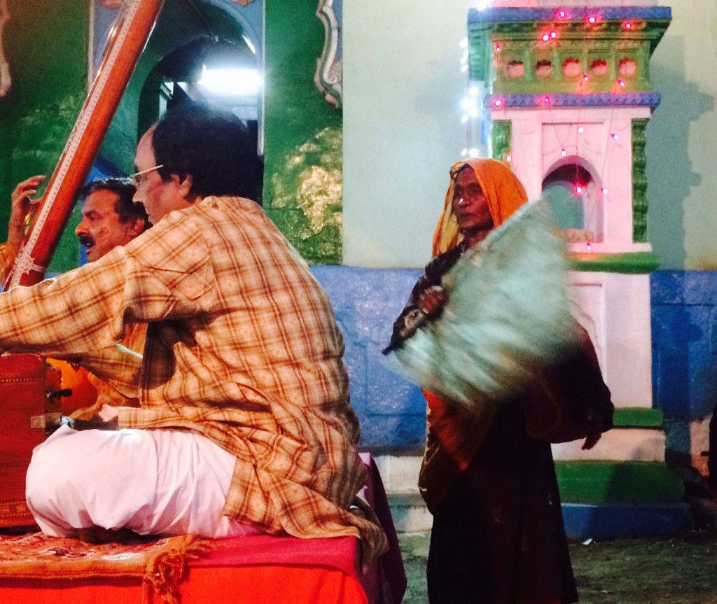 A fakira fans the musicians during the concert. Credit: Nikhil Inamdari
