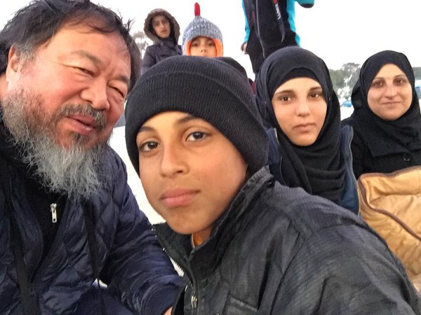 Ai Weiwei with some of the refugees in Lesbos, Greece. Credit: Twitter