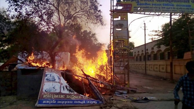 Mathura: A fire break out after clashes between the police and the encroachers who were being evicted from Jawaharbagh in Mathura on Thursday. PTI Photo (PTI6_2_2016_000256B)