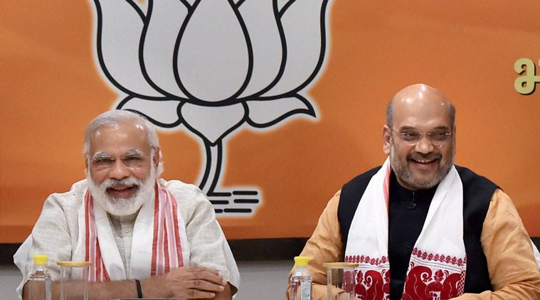 Prime Minister Narendra Modi with BJP president Amit Shah at a meeting at the party office in New Delhi after assembly poll results. Credit: PTI