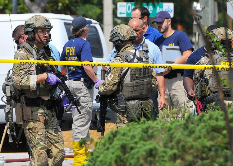 American security and FBI teams near the Orlando gay club where 50 people were killed by a shooter on Sunday. Credit: PTI