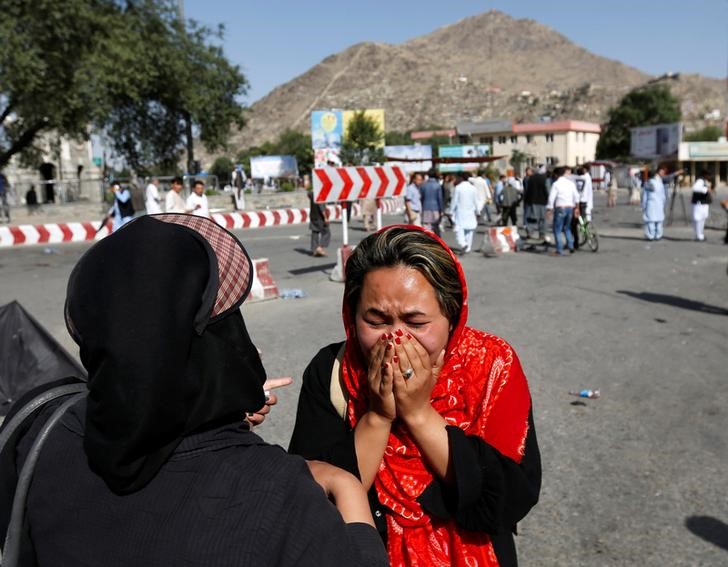 An Afghan woman weeps at the site of a suicide attack in Kabul, Afghanistan July 23, 2016. Credit: REUTERS/Mohammad Ismail