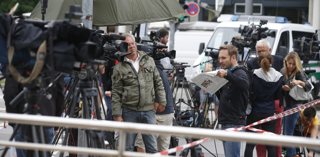Journalists gather near the Olympia shopping mall, where yesterday's shooting rampage started, in Munich, Germany July 23, 2016. Michael Dalder, Reuters/Files