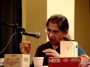 Sahasrabuddhe at a lecture-demonstration, explaining the difference between three ragas with the same scale. Credit: youtube