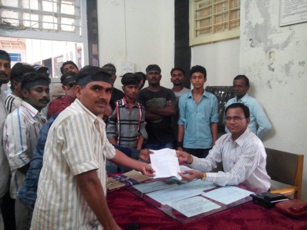 Nattubhai giving a memorandum with the demands of the leather workers union to the district collector. Credit: Mari Marcel Thekaekara