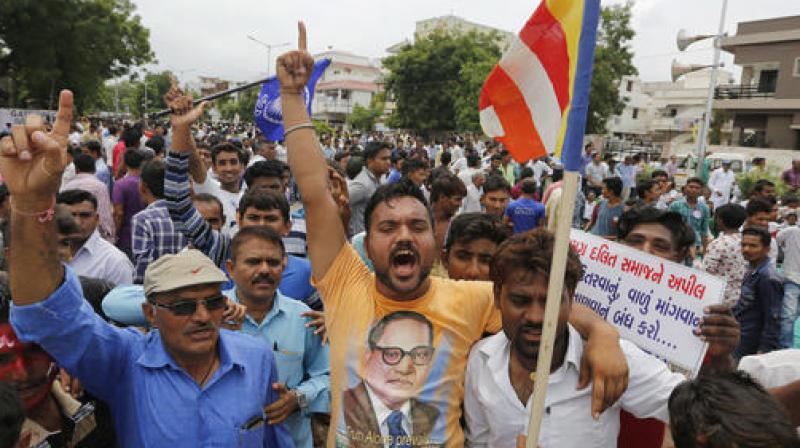 Dalit community members shout slogans at a protest rally in Ahmadabad. Credit: PTI