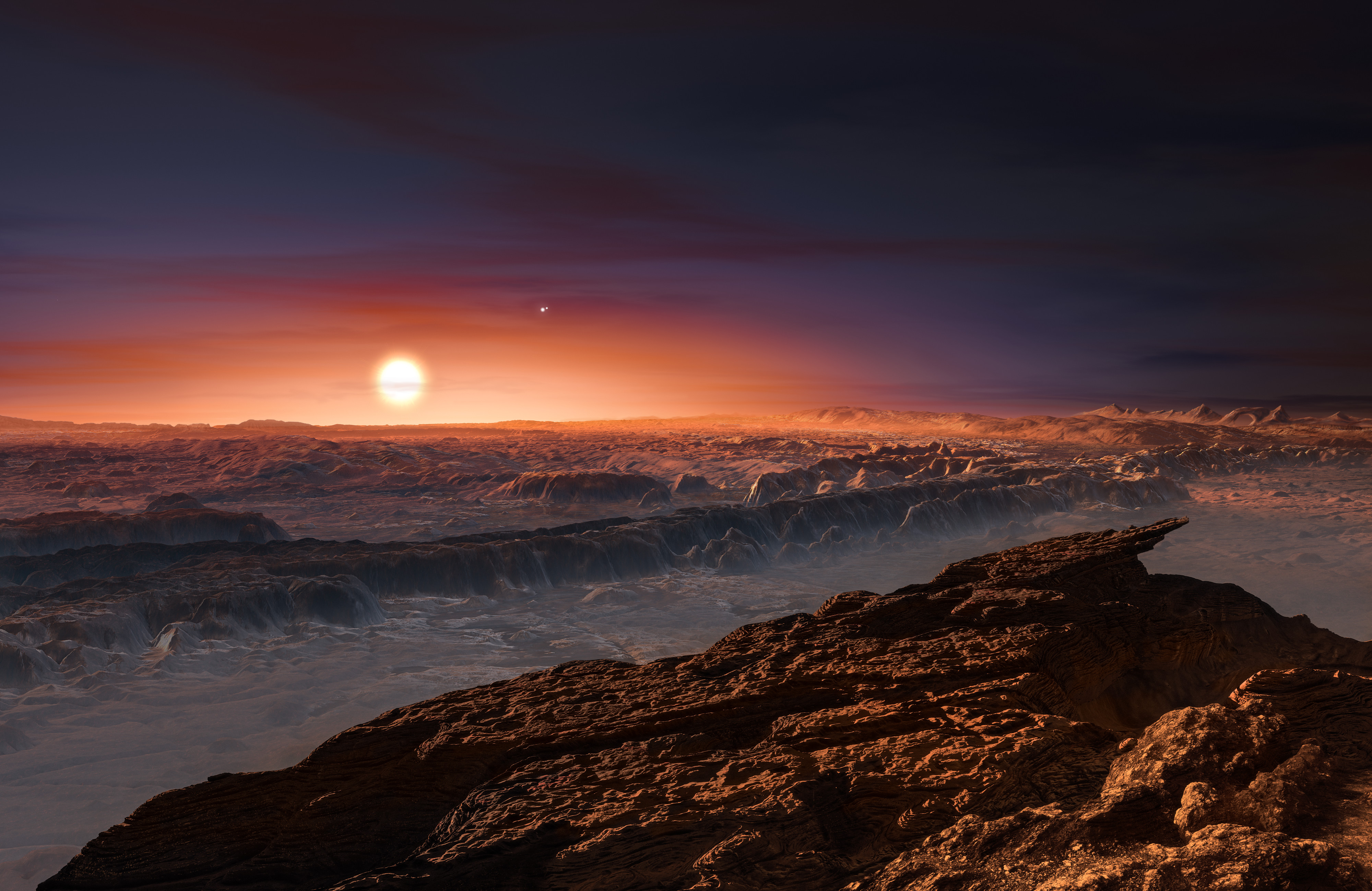 This artist’s impression shows a view of the surface of the planet Proxima b orbiting the red dwarf star Proxima Centauri, the closest star to the Solar System. The double star Alpha Centauri AB also appears in the image to the upper-right of Proxima itself. Proxima b is a little more massive than the Earth and orbits in the habitable zone around Proxima Centauri, where the temperature is suitable for liquid water to exist on its surface. Caption and credit: ESO/M. Kornmesser