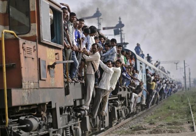 Passengers travel on an overcrowded train at Loni town in Uttar Pradesh. Credit: Reuters