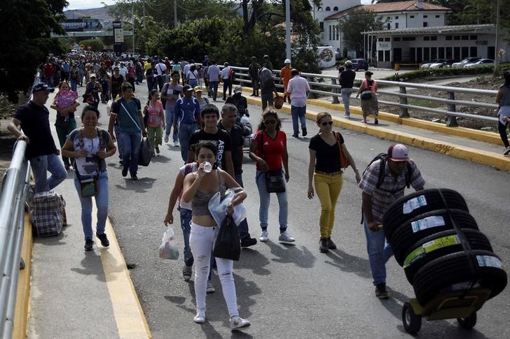 venezuelans flock across reopened border to columbia for food  basics