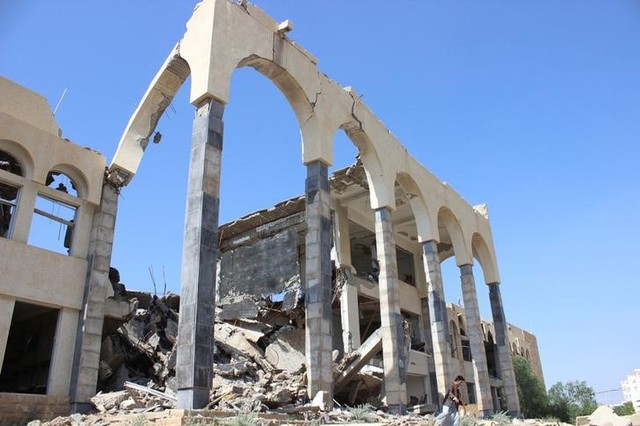 A man walks past the headquarters of the court of appeals destroyed by a Saudi-led air strike in Saada, Yemen August 28, 2016. Credit: Reuters/Naif Rahma