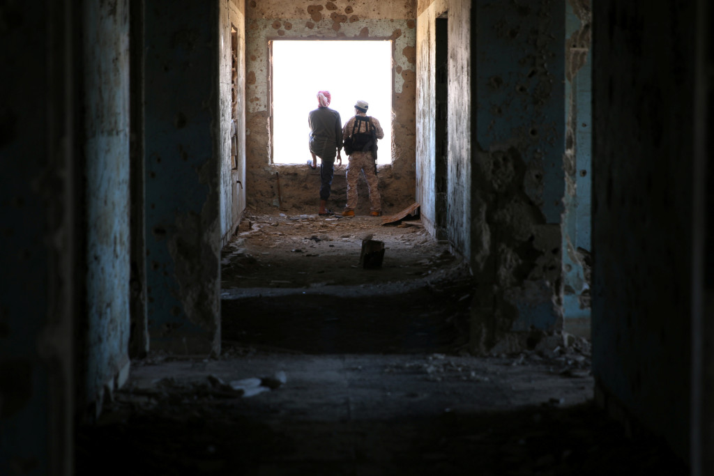 Rebel fighters stand in a damaged building in Quneitra countryside, Syria September 10, 2016. Credit: Reuters