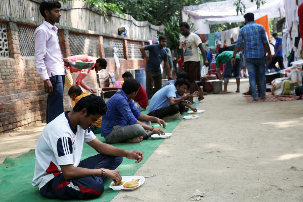 Lunch being served at the community kitchen, an effort funded by workers, activists, unions, and students. Credit: Hina Fathima
