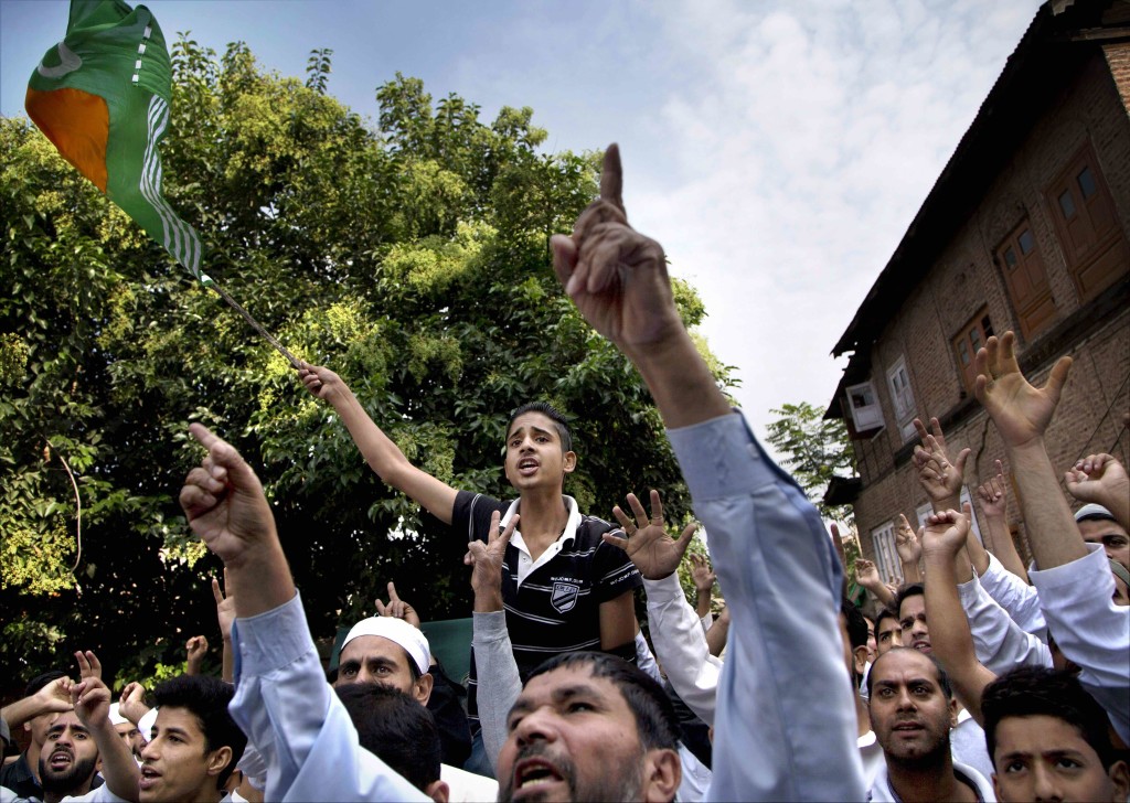 Kashmiri protesters shout freedom slogans during a protest after Eid prayers in Srinagar on Tuesday. Credit: PTI