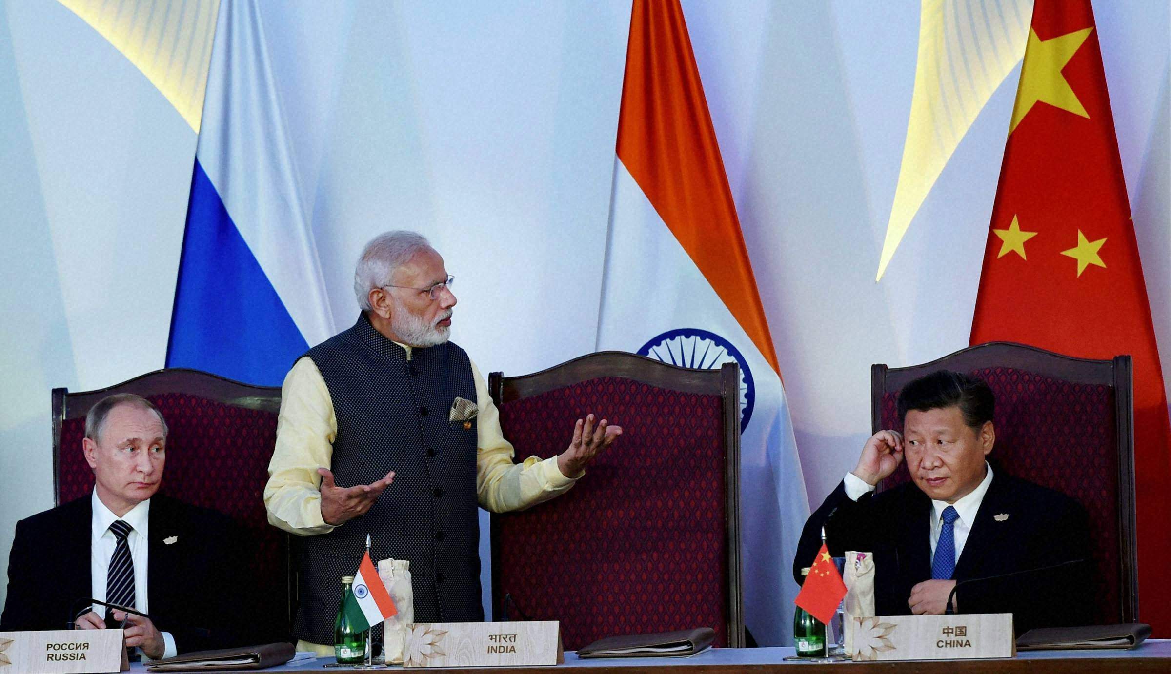 Prime Minister Narendra Modi stands between Russian president Vladimir Putin (left) and Chinese president Xi Jinping (right). Credit: PTI