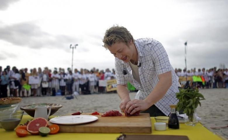 Jamie Oliver cooking in 2008. Credit: Reuters /Eric Thayer