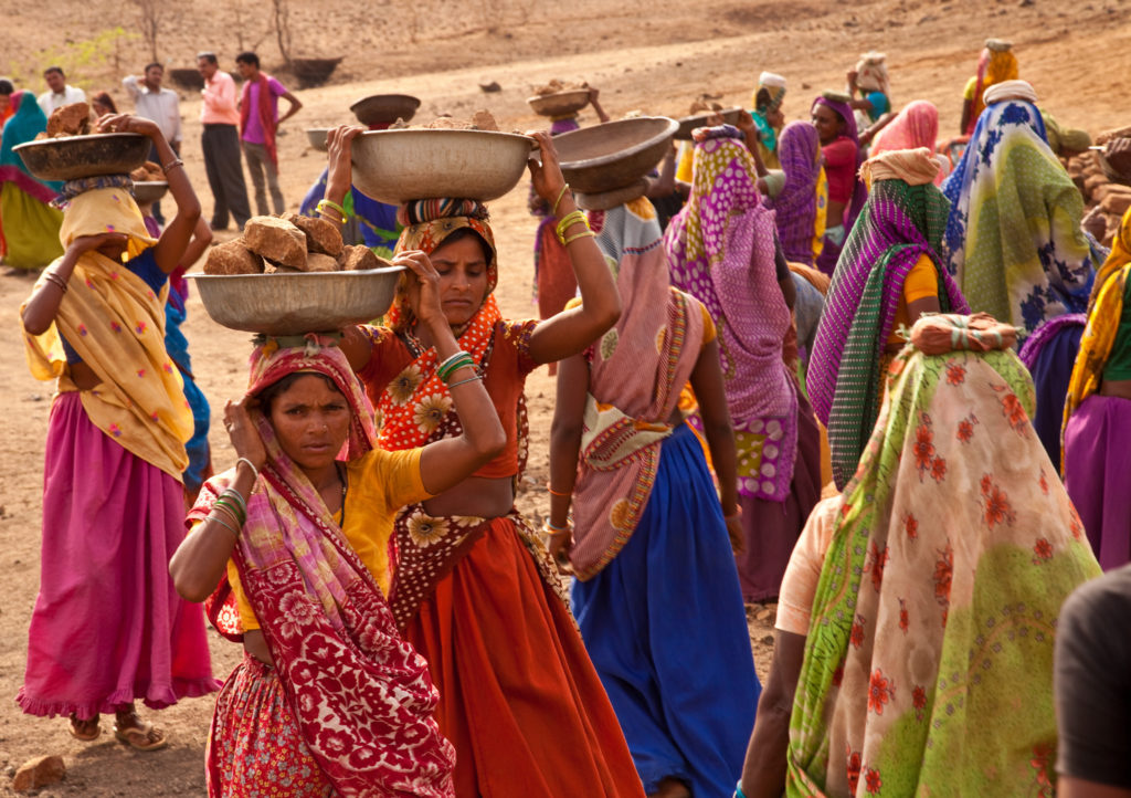 Women working on an NREGA site building a pond in Gopalpura, Jhabua, Madhya Pradesh. Credit: UN Woman/Gaganjit Singh/Flickr CC BY-NC-ND 2.0