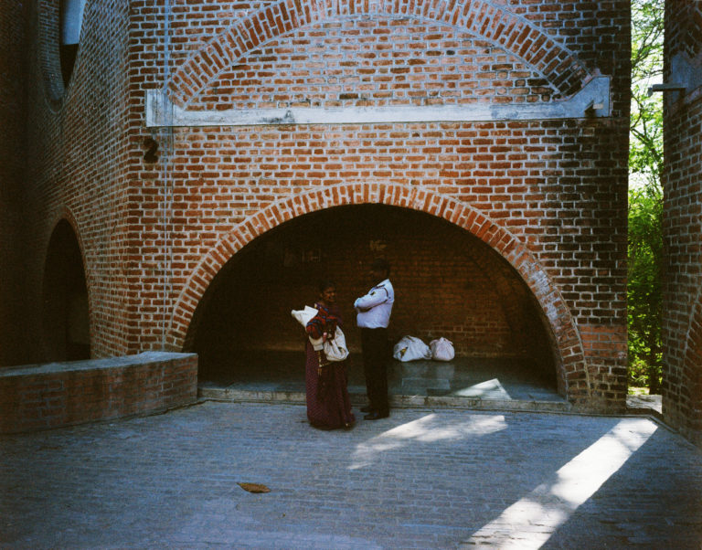 A washing woman talks to a security guard at Louis Kahn’s Indian Institute of Management in Ahmedabad. Credit: Lars Gezelius