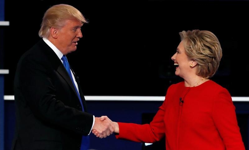Republican U.S. presidential nominee Donald Trump and Democratic U.S. presidential nominee Hillary Clinton shake hands at the end of their first presidential debate at Hofstra University in Hempstead, New York in September. Credit: Mike Segar, Reuters