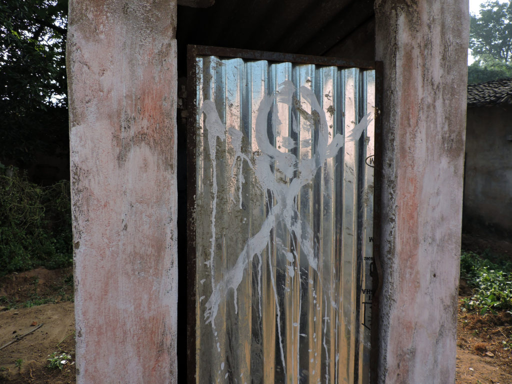 A danger sign painted by a villager on a toilet door in Dhamtari, Chhattisgarh. Credit: Ajay T.G.