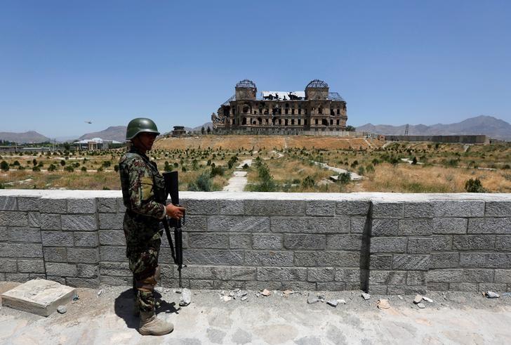 An Afghan National Army soldier stands guard after the inauguration of the reconstruction project to restore the ruins of historic Darul Aman palace, in Kabul, Afghanistan May 30, 2016. Credit: Reuters/Omar Sobhani