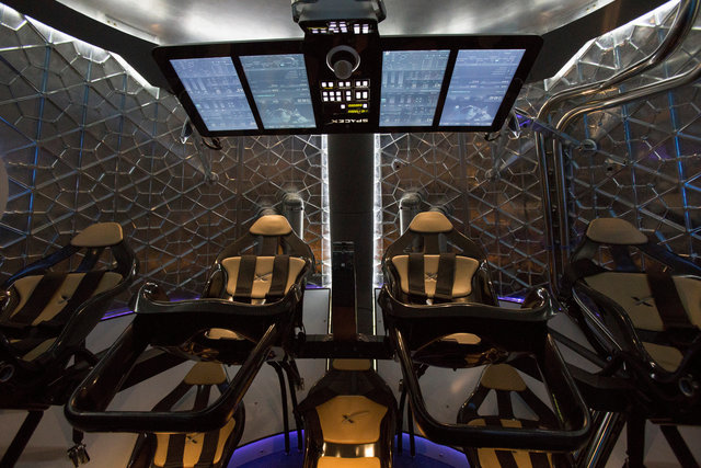 The cabin of the Dragon V2 spacecraft is pictured after it was unveiled in Hawthorne, California May 29, 2014. Credit: Reuters