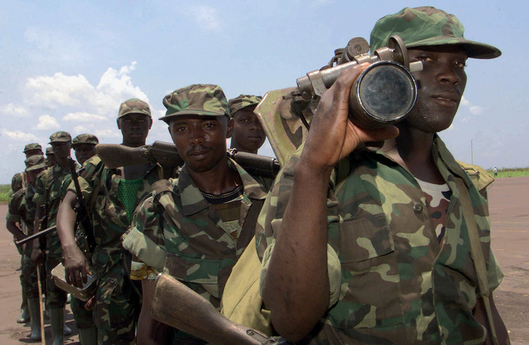 Rwandan soldiers departing the Democratic Republic of the Congo after peace accords were signed, 2002. Credit: Reuters