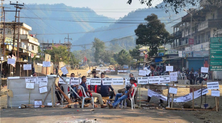 Bandh supporters block the highway during a strike call given by Joint Coordination Committee against 33% women's reservation and killing of two person in police firing in Dimapur, Nagaland on Friday. Credit: PTI