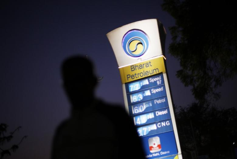 A Bharat Petroleum oil pump station as a pedestrian walks past in New Delhi. Credit: Reuters/Adnan Abidi/Files