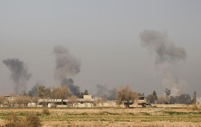 Smoke rises during a battle between Iraqi security forces with ISIS's militants south west Mosul, Iraq February 24, 2017. Credit: Reuters