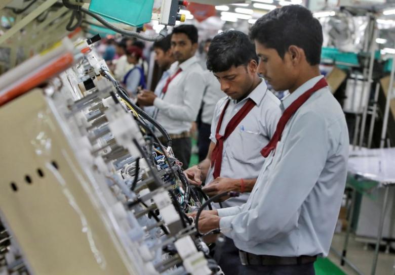 Employees of Motherson Sumi Systems Limited, work on a car wiring assembly line inside a factory in Noida on the outskirts of New Delhi, India April 28, 2016. Image for representation only. Credit: Reuters/Anindito Mukherjee/File Photo