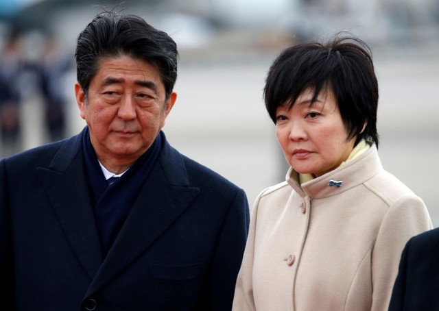 Japan's Prime Minister Shinzo Abe (L) and his wife Akie send off Emperor Akihito and Empress Michiko boarding a special flight for their visit to Vietnam and Thailand, at Haneda Airport in Tokyo, Japan February 28, 2017. Credit: Reuters