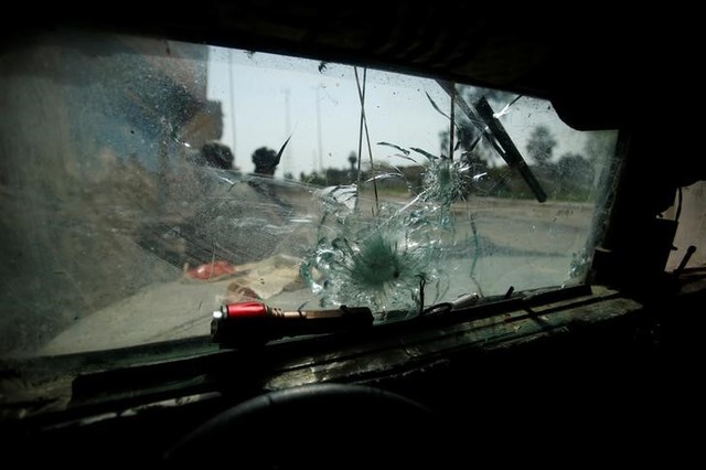 A broken glass window of military vehicle is seen during a battle with the militants in Mosul, Iraq March 29, 2017. Credit: Reuters
