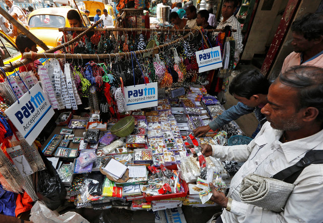 Advertisements of Paytm, a digital wallet company, are seen placed at a road side stall in Kolkata, India, January 25, 2017. Picture taken January 25, 2017. Credit: Reuters