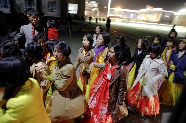 Women dressed in traditional costumes walk near the main Kim Il Sung square in central Pyongyang, North Korea April 11, 2017. Credit: Reuters/Damir Sagolj