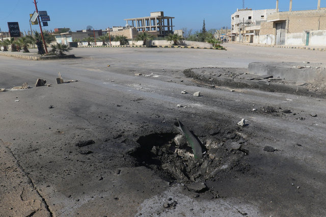 A crater is seen at the site of an airstrike, after what rescue workers described as a suspected gas attack in the town of Khan Sheikhoun in rebel-held Idlib, Syria April 4, 2017. Credit: Reuters