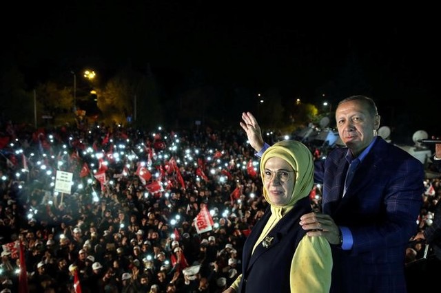 Turkish President Tayyip Erdogan, accompanied by his wife Emine Erdogan, addresses his supporters in Istanbul, Turkey, late April 16, 2017. Credit: Reuters/Yasin Bulbul/Presidential Palace