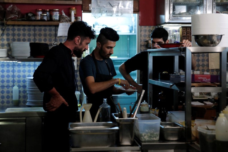 Syrian Kurd cook, Barshank Haj Younes 25, prepares a traditional Syrian dish during the Refugee Food Festival in Athens, Greece June 19, 2017. Credit: Reuters