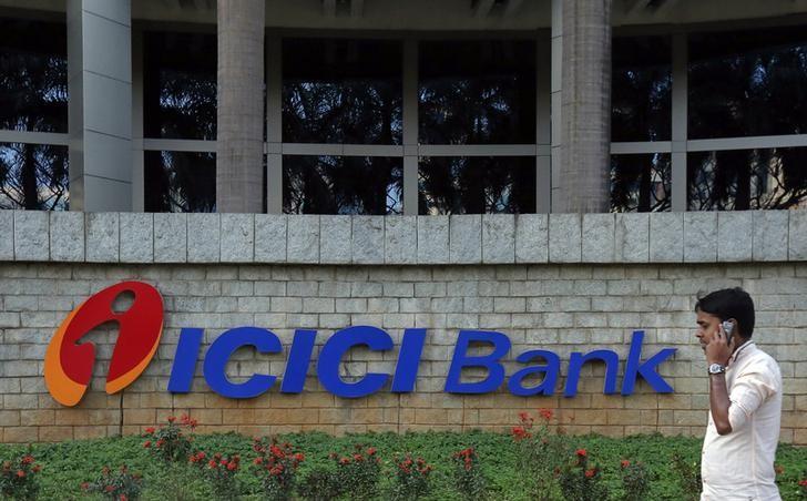 A pedestrian walks past a logo of ICICI Bank at its headquarters in Mumbai January 30, 2015. Credit: Reuters/Shailesh Andrade/Files