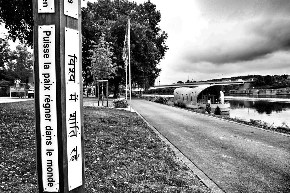 A wooden plaque placed along the Mosel river where the word 'peace' is written in Hindi. Credit: Shome Basu/The Wire