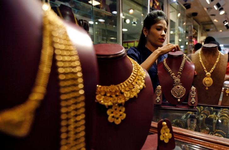 A salesperson attends to a customer (not pictured) inside a jewellery showroom, during Akshaya Tritiya, a major gold-buying festival, in Mumbai, India April 28, 2017. Credit: Reuters/Shailesh Andrade/File Photo