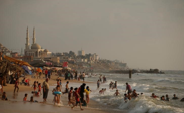 Palestinians swim in the Mediterranean Sea in Beit Lahiya town, in the northern Gaza Strip, July 6, 2017. Credit: Reuters/Mohammed Salem/Files